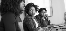 woman-discussing-with-her-colleagues-1181415